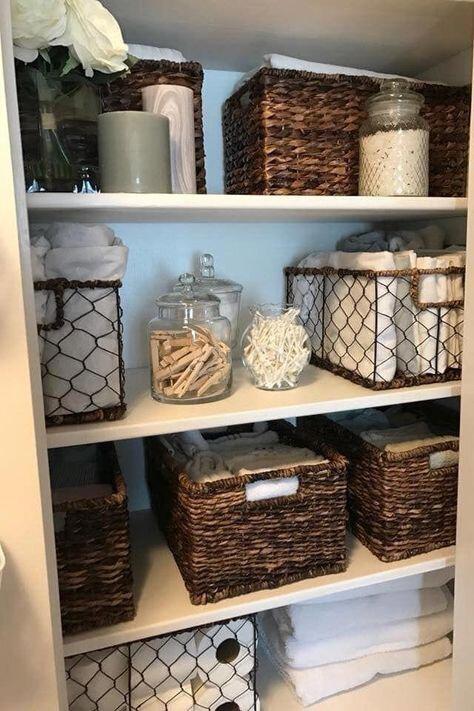 Bins and containers on shelves inside closet