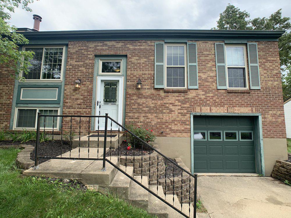 Brick house with green trim