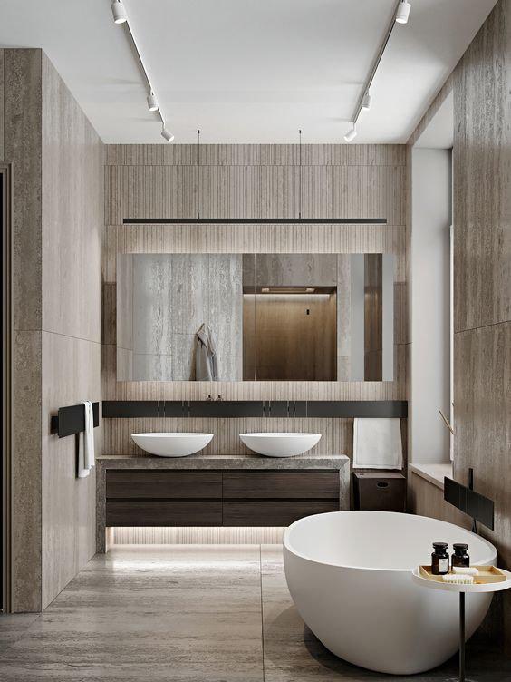 Contemporary style bathroom with brown walls, two sinks, and a bathtub