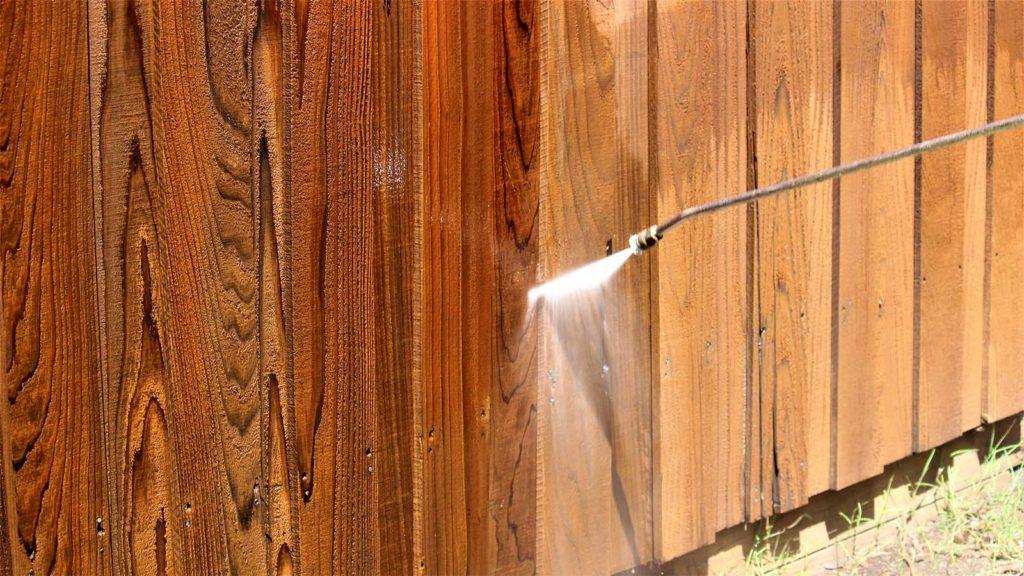 Fence getting power washed