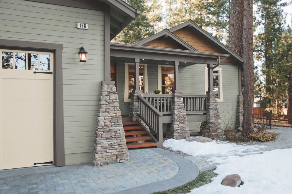 Front of house painted with muted gray-greens