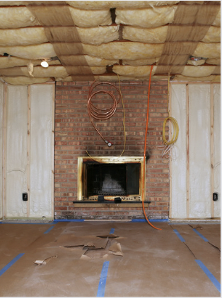 A room with walls being remodeled