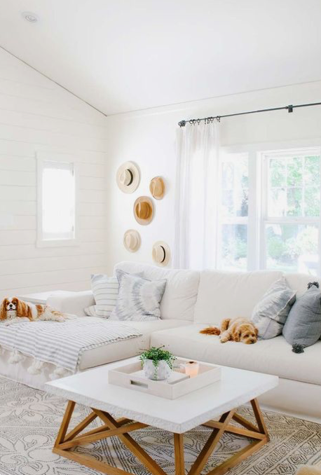 Living room with white walls and light colored accents
