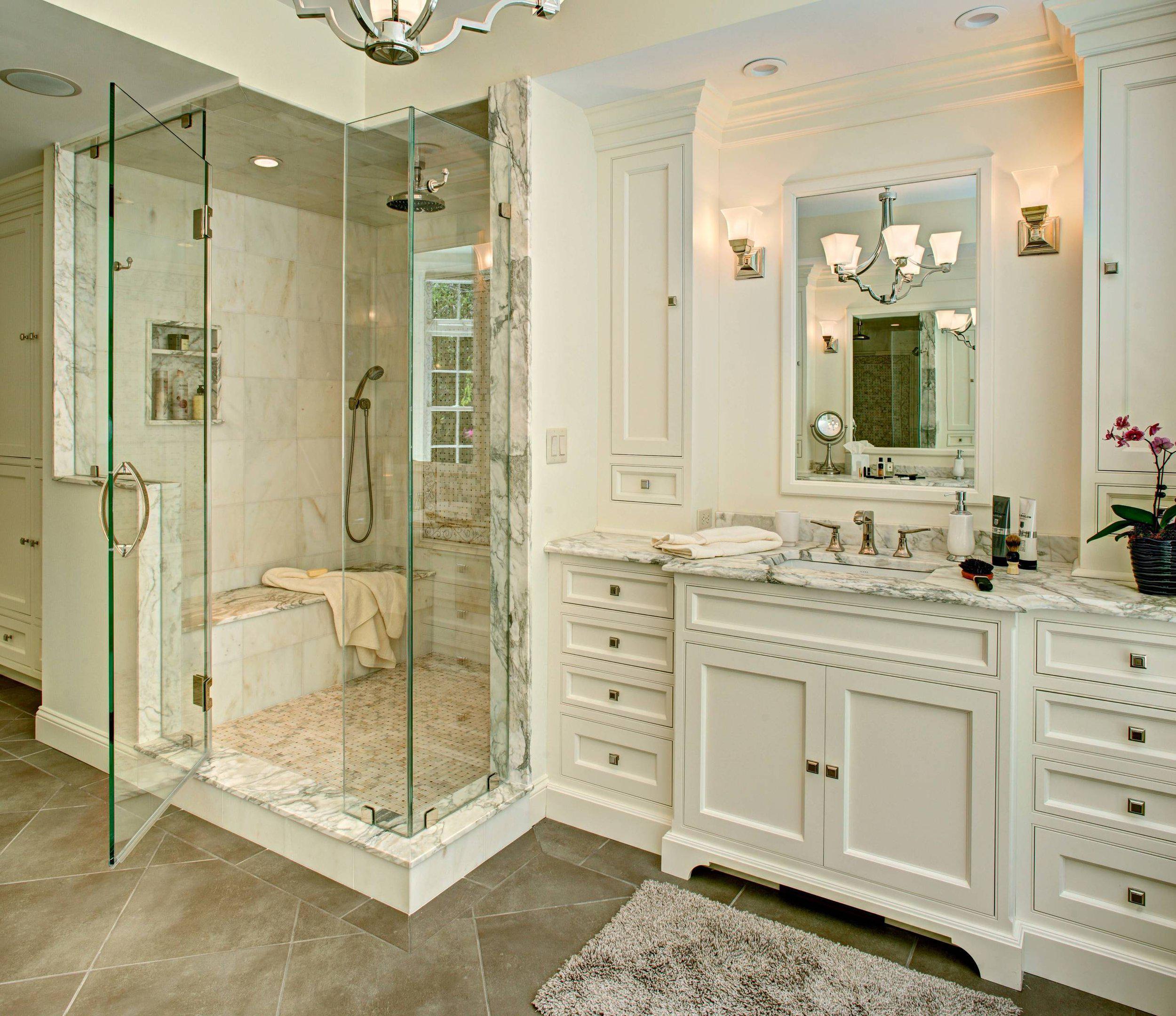 traditional style bathroom with white cabinets