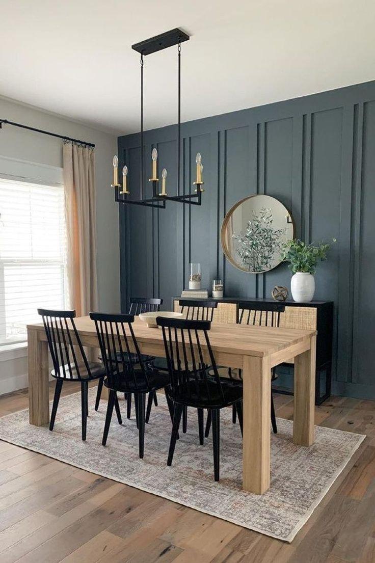 A dining room with a green wall